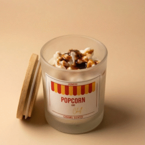 Jagmugg popcorn scented candle with caramel popcorn topping, ideal for cozy movie night and evening home rituals